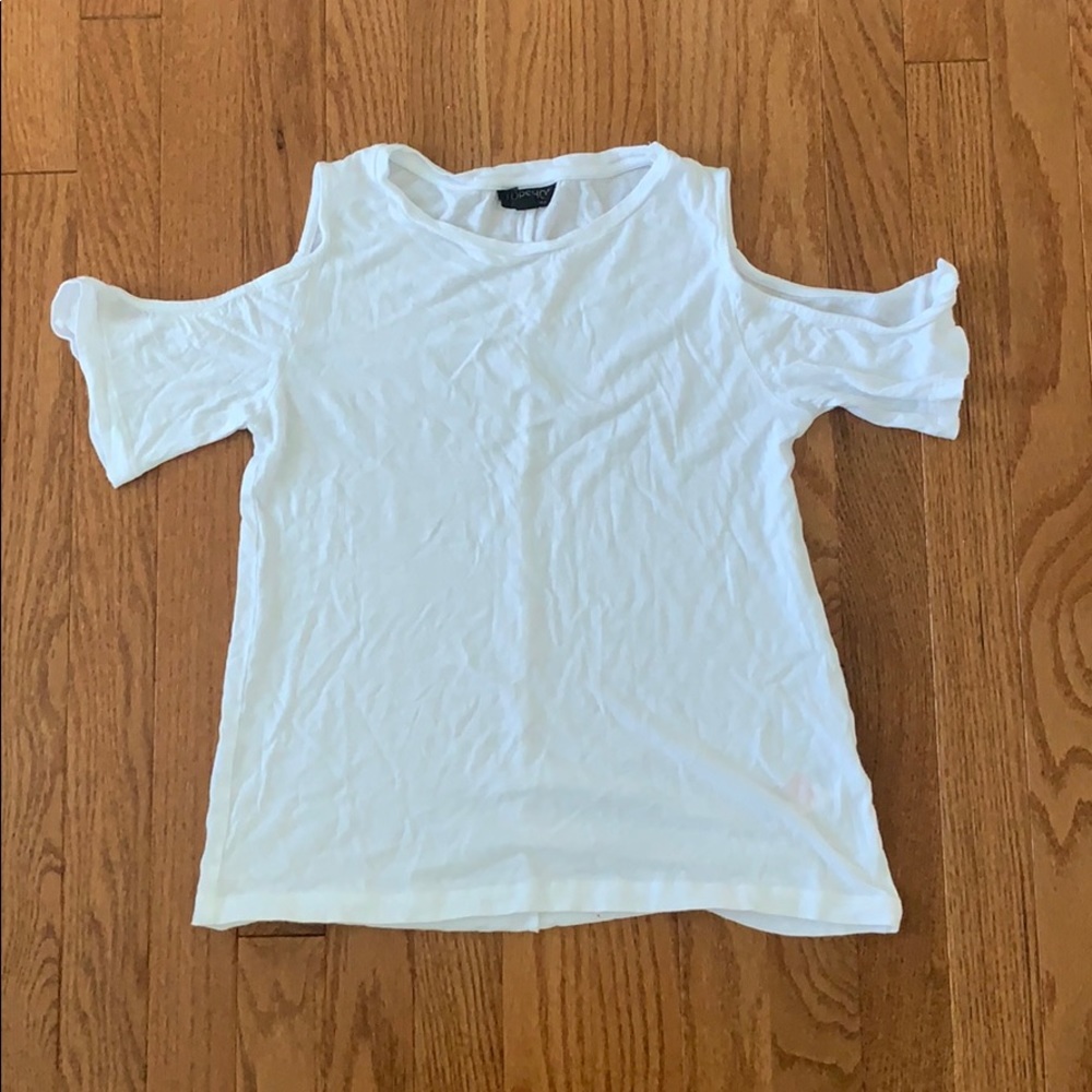 White top w shoulder cutouts